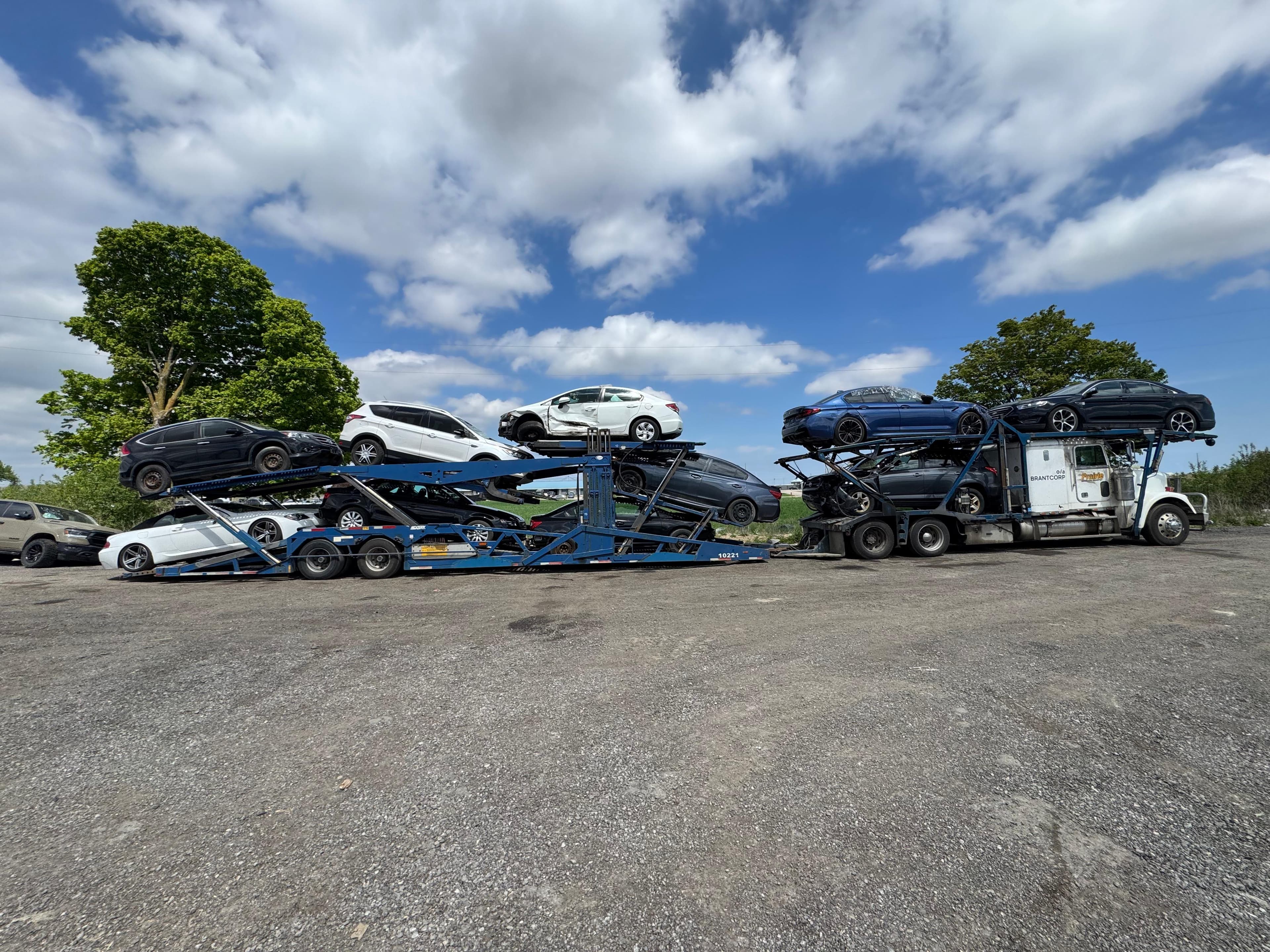 Prairie Auto Transport car carrier on Canadian highway